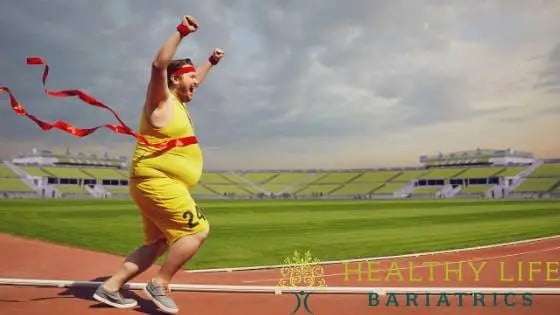 A man running on a track with the words healthy life bariatrics.