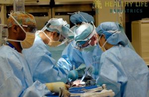 A group of surgeons working in an operating room.