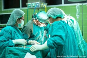 A group of surgeons working in an operating room.