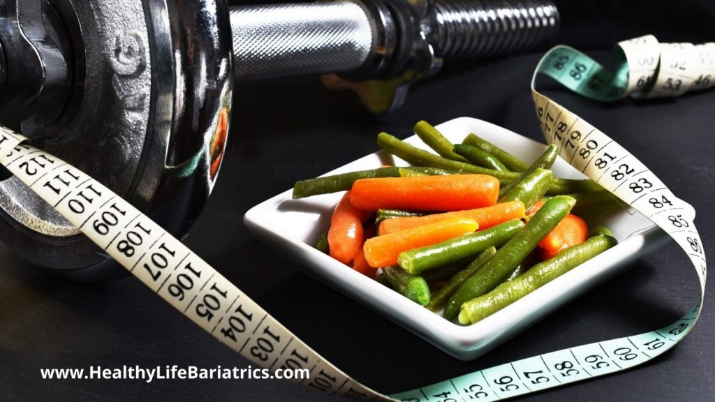 A bowl of vegetables and a measuring tape.