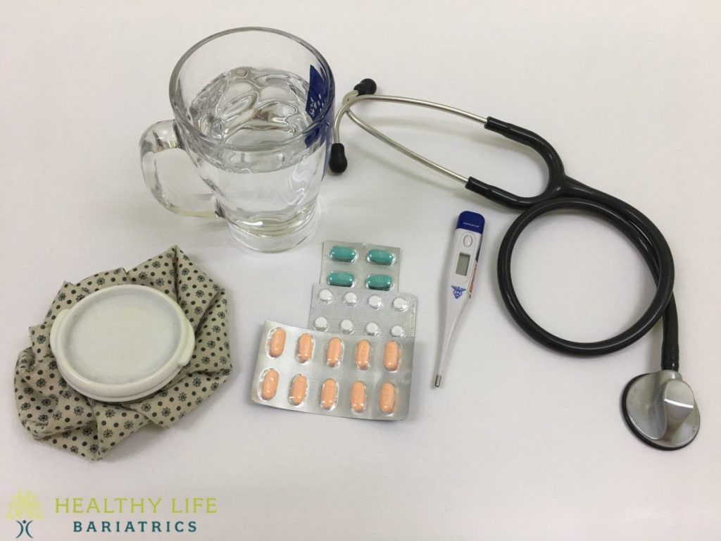 A stethoscope, a bottle of water and a stethoscope on a table.