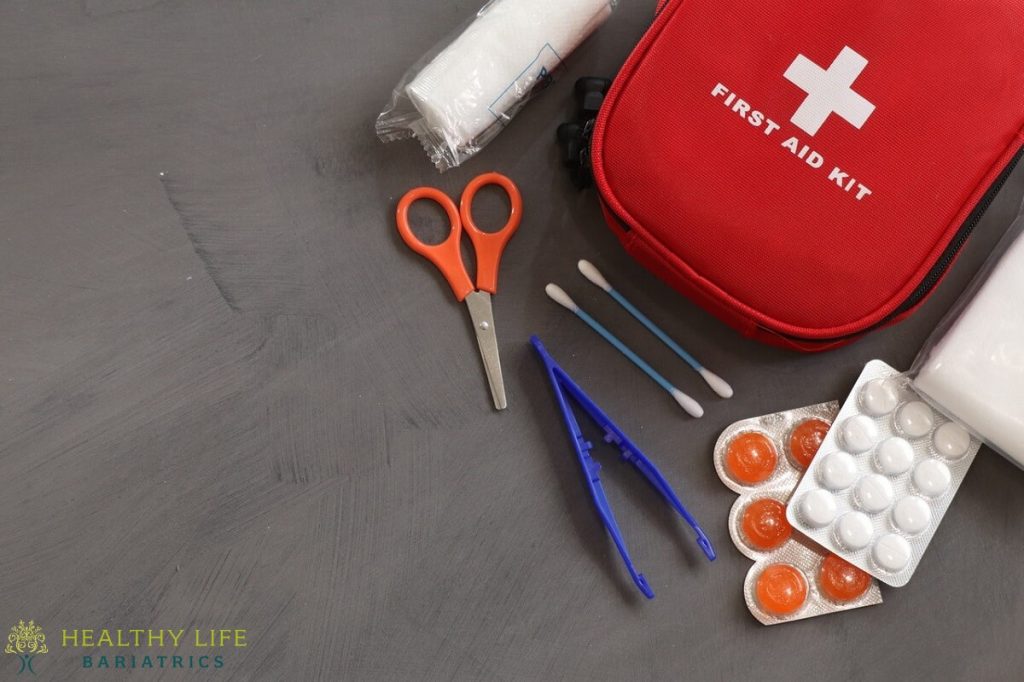 First aid kit with scissors and other items.