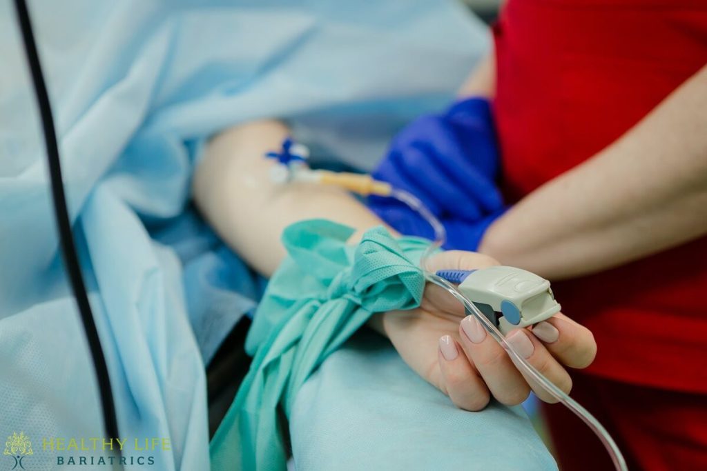 An iv drip being given to a patient in a hospital.