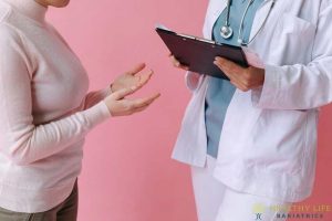 A female doctor is talking to a female patient.