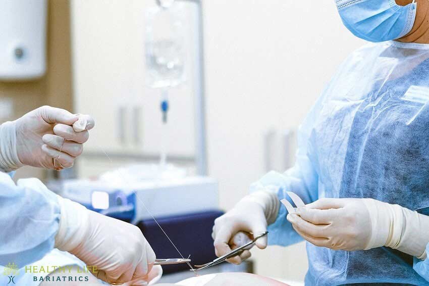 A surgeon is performing surgery on a patient.