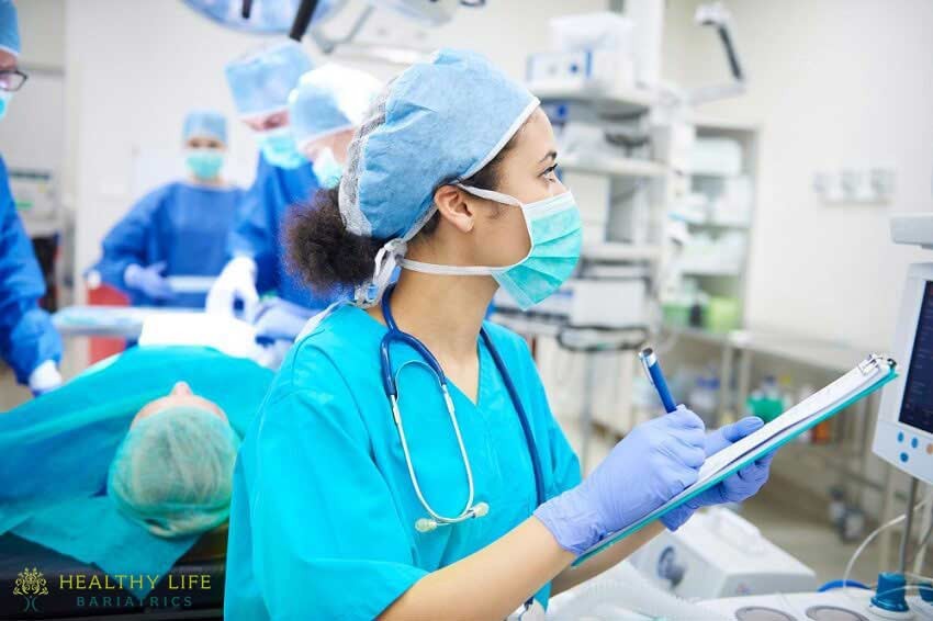 A group of surgeons working in an operating room.