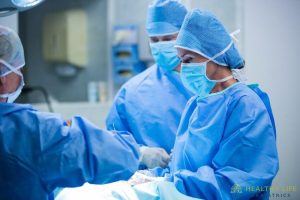 A group of surgeons working in an operating room.