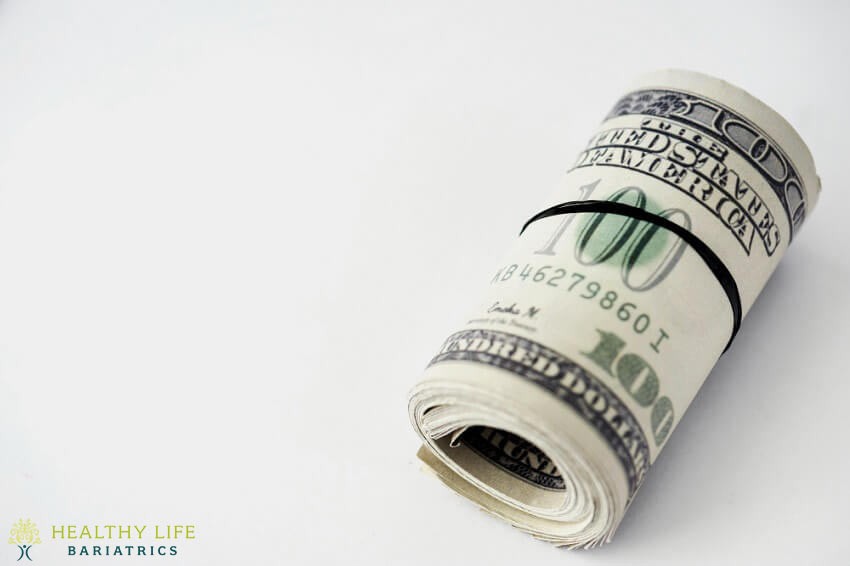 A stack of dollar bills on a white background.