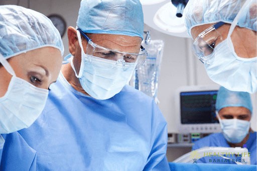 A group of surgeons working in an operating room.