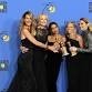 A group of women posing with their awards at the Golden Globe Awards ceremony.